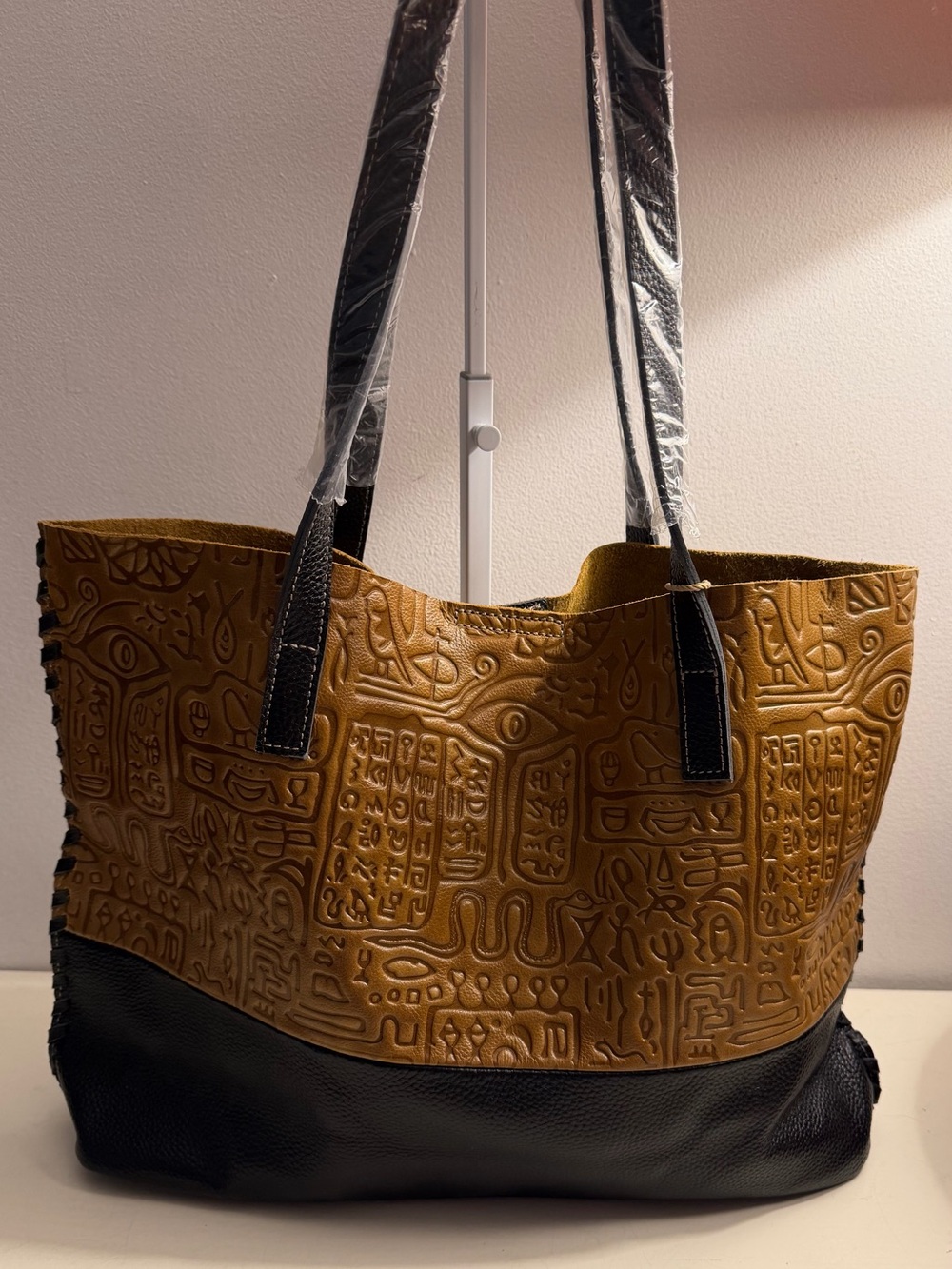 Italy Retro Noble Collection leather tote with embossed hieroglyphics.